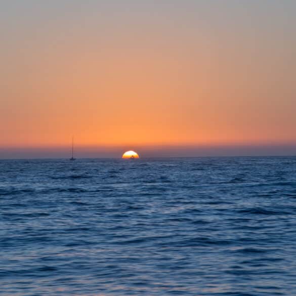 Sun sets over the pacific ocean